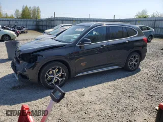 2017 BMW X1 xDrive28i with VIN WBXHT3C32H5F82141, listed as a Copart auction lot 53311785 with 52,867 mi miles and Salvage Title. Bid and sale history available at carsss.com. Image 1.