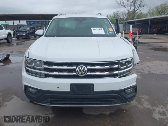2019 Volkswagen Atlas SE z VIN 1V2WR2CA9KC593891, wystawiony jako IAAI lot #41947078 z przebiegiem 74 525 mil mil oraz . Historia ofert i sprzedaży dostępna na DreamBid. Obrazek 13.