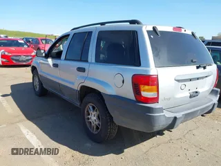 2003 Jeep Grand Cherokee Laredo with VIN 1J4GX48S03C577759, listed as a IAAI auction lot 41969103 with 91,305 mi miles. Bid and sale history available at carsss.com. Image 3.