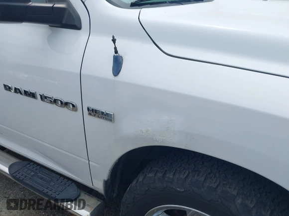 2012 Ram 1500 Outdoorsman z VIN 1C6RD7LT6CS122906, wystawiony jako IAAI lot #42359190 z przebiegiem 170 183 mil mil oraz . Historia ofert i sprzedaży dostępna na DreamBid. Obrazek 6.