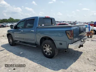 2011 Nissan Titan SL with VIN 1N6AA0EC4BN305296, listed as a Copart auction lot 59001395 with 194,557 mi miles and Salvage title. Bid and sale history available at DreamBid. Image 2.