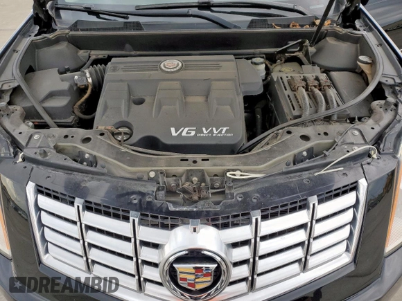 2015 Cadillac SRX Premium Collection z VIN 3GYFNDE33FS574125, wystawiony jako Copart lot #55530575 z przebiegiem 76 956 mil mil oraz Szkoda całkowita • Salvage title. Historia ofert i sprzedaży dostępna na DreamBid. Obrazek 12.