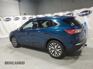 2020 Ford Escape Titanium z VIN 1FMCU9J98LUA93393, wystawiony jako Copart lot #65366925 z przebiegiem 74 750 mil mil oraz Czysty tytuł • Clean title. Historia ofert i sprzedaży dostępna na DreamBid. Obrazek 2.
