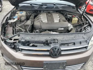 2012 Volkswagen Touareg Lux с VIN WVGEK9BPXCD012003, выставлен на аукционе Copart как лот 54910865 с пробегом 106 465 миль миль и Списание • Salvage title. История ставок и продаж доступна на DreamBid. Изображение 12.