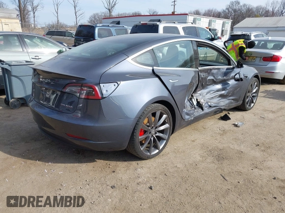 2018 Tesla Model 3 Long Range Battery with VIN 5YJ3E1EB5JF063077, listed as a IAAI auction lot 41773551 with 99,477 mi miles and . Bid and sale history available at DreamBid. Image 4.