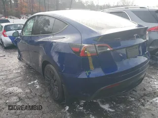 2024 Tesla Model Y Long Range with VIN 7SAYGDEE1RA319271, listed as a IAAI auction lot 41530466 with 7,934 mi miles. Bid and sale history available at carsss.com. Image 3.