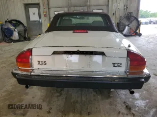 1989 Jaguar XJS z VIN SAJNV4847KC151989, wystawiony jako Copart lot #61401054 z przebiegiem 80 570 mil mil oraz Szkody całkowita. Historia ofert i sprzedaży dostępna na DreamBid. Obrazek 6.