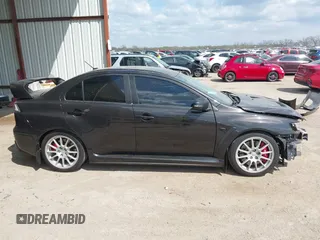 2015 Mitsubishi Lancer Evolution GSR z VIN JA32W8FV2FU020047, wystawiony jako IAAI lot #41890897 z przebiegiem 121 089 mil mil oraz . Historia ofert i sprzedaży dostępna na DreamBid. Obrazek 14.