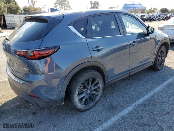 2024 Mazda CX-5 2.5 S Carbon Edition with VIN JM3KFBCM8R0350997, listed as a Copart auction lot 44432625 with 56,568 mi miles and Salvage Title. Bid and sale history available at carsss.com. Image 3.