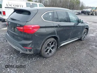 2018 BMW X1 xDrive28i with VIN WBXHT3C34J5K31430, listed as a IAAI auction lot 41954792 with 125,447 mi miles. Bid and sale history available at carsss.com. Image 4.
