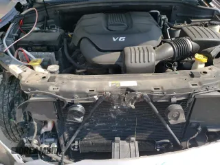 2014 Dodge Durango SXT z VIN 1C4RDJAG8EC455892, wystawiony jako Copart lot #57796095 z przebiegiem 98 251 mil mil oraz Szkoda całkowita • Salvage title. Historia ofert i sprzedaży dostępna na DreamBid. Obrazek 11.