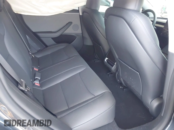 2025 Tesla Model 3 Long Range with VIN 5YJ3E1EA5SF978214, listed as a IAAI auction lot 42525444 with 6,489 mi miles and . Bid and sale history available at DreamBid. Image 8.