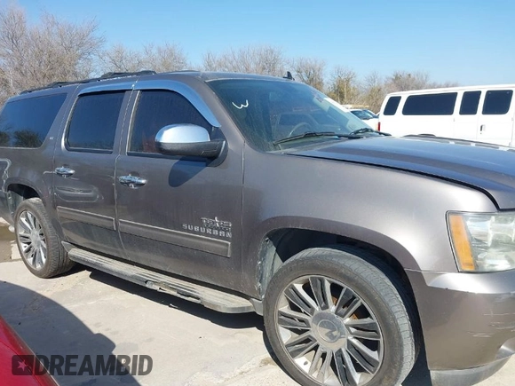 2011 Chevrolet Suburban LT with VIN 1GNSCJE03BR381301, listed as a IAAI auction lot 41412636 with 243,601 mi miles. Bid and sale history available at carsss.com. Image 1.