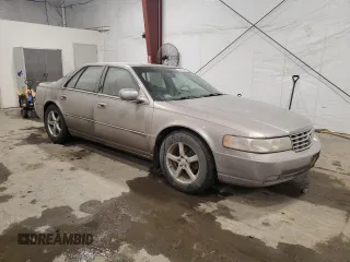 1998 Cadillac Seville STS z VIN 1G6KY5490WU916771, wystawiony jako Copart lot #58699555 z przebiegiem 129 944 mil mil oraz Nie do naprawy. Historia ofert i sprzedaży dostępna na DreamBid. Obrazek 4.