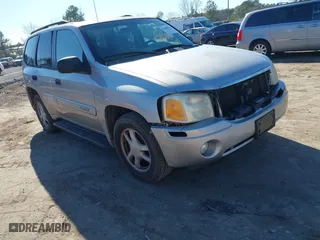 2004 GMC Envoy SLE with VIN 1GKDT13S642213710, listed as a IAAI auction lot 41680656 with 239,187 mi miles. Bid and sale history available at carsss.com. Image 1.