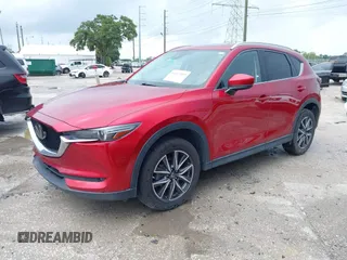 2018 Mazda CX-5 Grand Touring with VIN JM3KFADM5J0437365, listed as a IAAI auction lot 42657919 with 96,760 mi miles and . Bid and sale history available at DreamBid. Image 2.