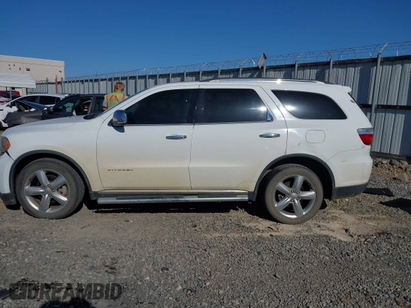 2013 Dodge Durango Citadel with VIN 1C4SDHET0DC571961, listed as a IAAI auction lot 42050261 with 257,637 mi miles and . Bid and sale history available at DreamBid. Image 14.