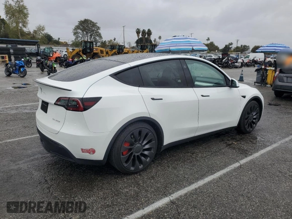 2023 Tesla Model Y Performance with VIN 7SAYGDEF1PF809654, listed as a Copart auction lot 43981915 with 16,401 mi miles and Salvage Title. Bid and sale history available at DreamBid. Image 3.