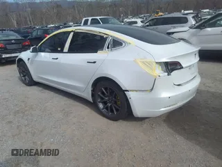 2020 Tesla Model 3 Standard Range Plus with VIN 5YJ3E1EA0LF597839, listed as a IAAI auction lot 41639219 with 49,220 mi miles. Bid and sale history available at carsss.com. Image 3.