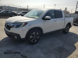 2017 Honda Ridgeline RTL-T with VIN 5FPYK2F65HB011097, listed as a Copart auction lot 63687965 with 186,157 mi miles and Salvage title. Bid and sale history available at DreamBid. Image 1.
