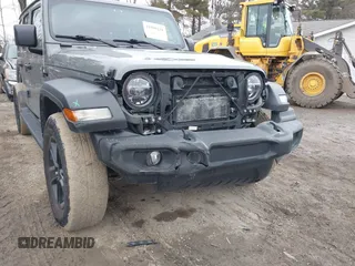 2021 Jeep Wrangler Unlimited Sport Altitude with VIN 1C4HJXDG1MW603784, listed as a IAAI auction lot 41509231 with 102,567 mi miles and . Bid and sale history available at DreamBid. Image 6.