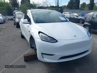 2023 Tesla Model Y Long Range z VIN 7SAYGDEE9PA094191, wystawiony jako IAAI lot #41906319 z przebiegiem 15 240 mil mil oraz . Historia ofert i sprzedaży dostępna na DreamBid. Obrazek 1.