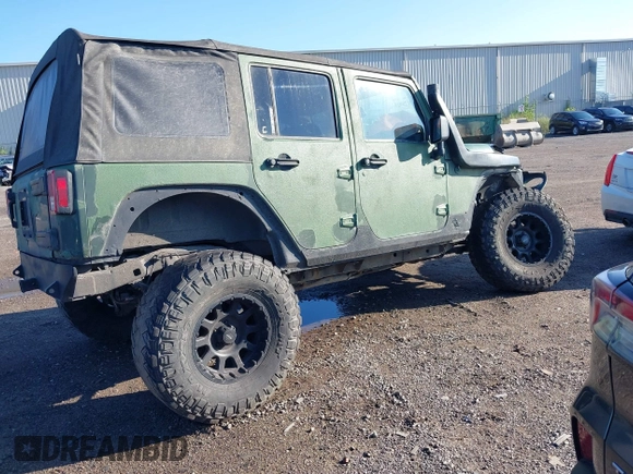 2008 Jeep Wrangler Unlimited X z VIN 1J4GA39198L612727, wystawiony jako IAAI lot #40128925 z przebiegiem 260 573 mil mil oraz . Historia ofert i sprzedaży dostępna na DreamBid. Obrazek 4.