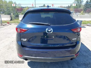 2019 Mazda CX-5 Signature with VIN JM3KFBEY7K0589236, listed as a IAAI auction lot 42078418 with 86,959 mi miles. Bid and sale history available at carsss.com. Image 16.