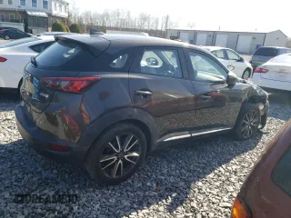 2016 Mazda CX-3 Grand Touring z VIN JM1DKBD7XG0107274, wystawiony jako Copart lot #52137385 z przebiegiem 35 376 mil mil oraz Szkoda całkowita • Salvage title. Historia ofert i sprzedaży dostępna na DreamBid. Obrazek 3.