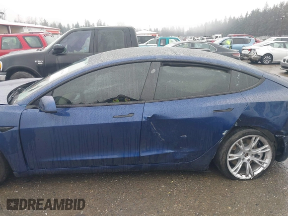 2022 Tesla Model 3 Long Range with VIN 5YJ3E1EB1NF142574, listed as a IAAI auction lot 41213900 with 127,404 mi miles and . Bid and sale history available at DreamBid. Image 14.