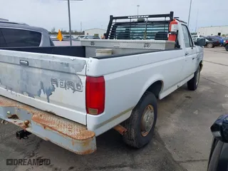 1993 Ford F-250 HD with VIN 1FTHF25HXPLB13295, listed as a IAAI auction lot 41697706 with 38,414 mi miles. Bid and sale history available at carsss.com. Image 4.