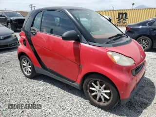 2009 Smart fortwo Pure z VIN WMEEJ31X89K291074, wystawiony jako Copart lot #56897635 z przebiegiem 145 504 mil mil oraz Tytuł czysty. Historia ofert i sprzedaży dostępna na DreamBid. Obrazek 4.