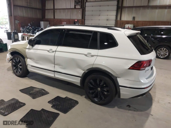 2020 Volkswagen Tiguan SE with VIN 3VV2B7AX1LM106600, listed as a IAAI auction lot 40259436 with 56,736 mi miles. Bid and sale history available at carsss.com. Image 3.