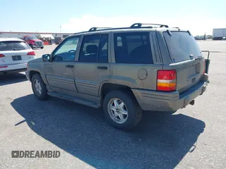 1996 Jeep Grand Cherokee Limited with VIN 1J4GZ78Y1TC162546, listed as a IAAI auction lot 42612646 with 204,098 mi miles and . Bid and sale history available at DreamBid. Image 3.