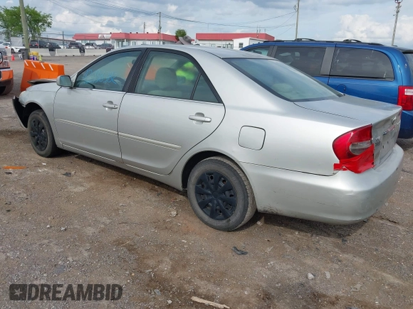 2004 Toyota Camry LE with VIN 4T1BE32K84U374943, listed as a IAAI auction lot 42038382 with 323,419 mi miles. Bid and sale history available at carsss.com. Image 3.