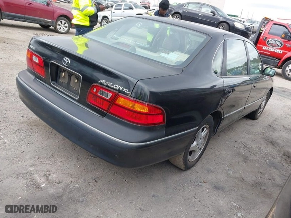 1999 Toyota Avalon XL with VIN 4T1BF18B2XU330305, listed as a IAAI auction lot 41717284 with NaN miles. Bid and sale history available at carsss.com. Image 4.