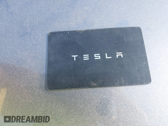 2018 Tesla Model 3 Long Range Battery with VIN 5YJ3E1EB7JF114305, listed as a IAAI auction lot 41765994 with 76,945 mi miles and . Bid and sale history available at DreamBid. Image 11.