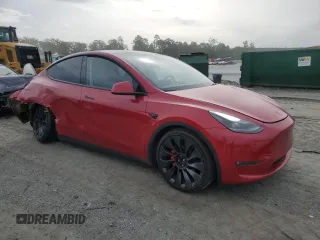 2023 Tesla Model Y Performance z VIN 7SAYGDEF2PF857843, wystawiony jako Copart lot #57324255 z przebiegiem 22 618 mil mil oraz Szkoda całkowita • Salvage title. Historia ofert i sprzedaży dostępna na DreamBid. Obrazek 4.