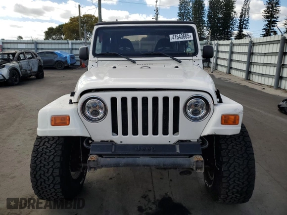 1999 Jeep Wrangler Sahara with VIN 1J4FY49SXXP414414, listed as a Copart auction lot 41643665 with 154,810 mi miles and Salvage Title. Bid and sale history available at carsss.com. Image 5.