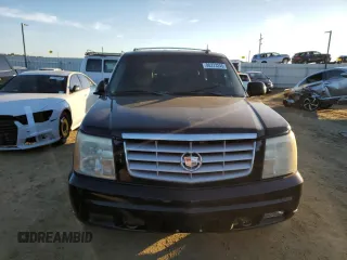 2003 Cadillac Escalade z VIN 1GYEC63TX3R135227, wystawiony jako Copart lot #88373245 z przebiegiem 258 595 mil mil oraz Czysty tytuł • Clean title. Historia ofert i sprzedaży dostępna na DreamBid. Obrazek 5.
