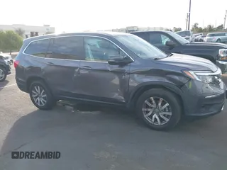 2021 Honda Pilot EX-L with VIN 5FNYF5H54MB018846, listed as a IAAI auction lot 41208987 with 80,757 mi miles and . Bid and sale history available at DreamBid. Image 6.