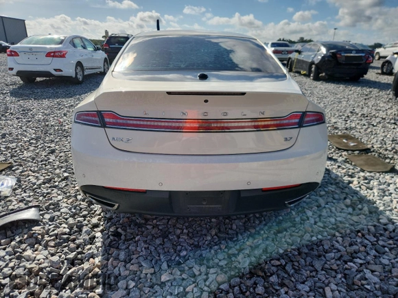 2013 Lincoln MKZ z VIN 3LN6L2GK1DR816558, wystawiony jako Copart lot #60424415 z przebiegiem 95 593 mil mil oraz Szkoda całkowita • Salvage title. Historia ofert i sprzedaży dostępna na DreamBid. Obrazek 6.