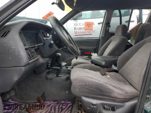 1997 Jeep Grand Cherokee Laredo with VIN 1J4GZ58S5VC720174, listed as a Copart auction lot 44169635 with Not provided miles and Salvage title. Bid and sale history available at DreamBid. Image 7.