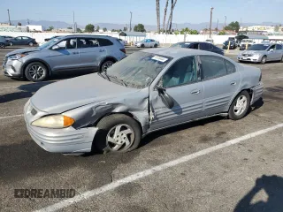 1999 Pontiac Grand Am SE2 with VIN 1G2NE52E1XM779879, listed as a Copart auction lot 74106444 with 146,960 mi miles and Salvage Title. Bid and sale history available at carsss.com. Image 1.