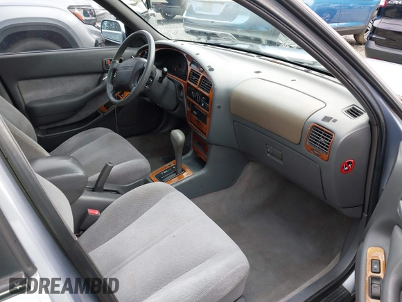 1996 Toyota Camry DX with VIN JT2BG12K2T0396941, listed as a IAAI auction lot 41593032 with 205,514 mi miles. Bid and sale history available at carsss.com. Image 5.