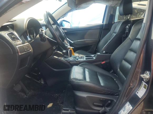 2016 Mazda CX-5 Grand Touring z VIN JM3KE4DY5G0741800, wystawiony jako Copart lot #58565455 z przebiegiem 33 675 mil mil oraz Szkoda całkowita • Salvage title. Historia ofert i sprzedaży dostępna na DreamBid. Obrazek 7.