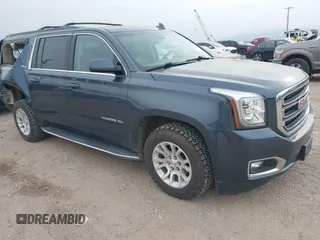 2019 GMC Yukon XL SLT with VIN 1GKS2GKC0KR345860, listed as a IAAI auction lot 40727072 with 127,568 mi miles and . Bid and sale history available at carsss.com. Image 1.