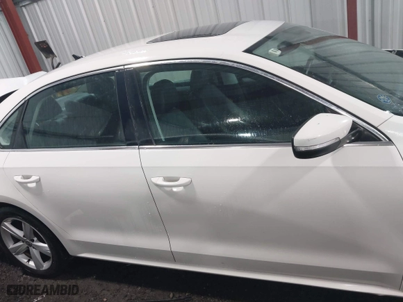 2013 Volkswagen Passat SE w/Sunroof with VIN 1VWBH7A35DC111003, listed as a IAAI auction lot 41991990 with 142,103 mi miles. Bid and sale history available at carsss.com. Image 13.