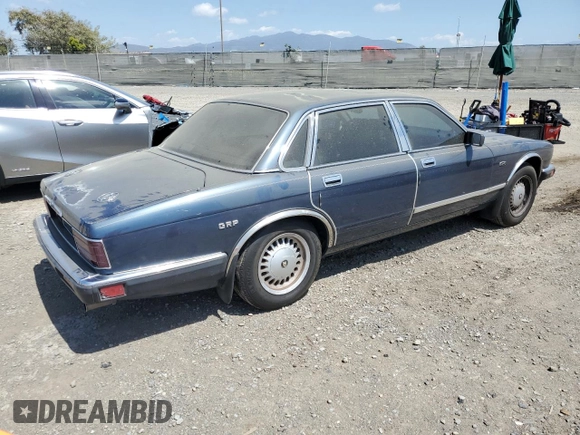 1992 Jaguar XJ with VIN SAJHY174XNC649368, listed as a Copart auction lot 50191454 with 99,553 mi miles and Salvage Title. Bid and sale history available at DreamBid. Image 3.
