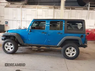 2015 Jeep Wrangler Unlimited Rubicon with VIN 1C4BJWFG7FL661643, listed as a IAAI auction lot 41291385 with 112,785 mi miles. Bid and sale history available at carsss.com. Image 15.